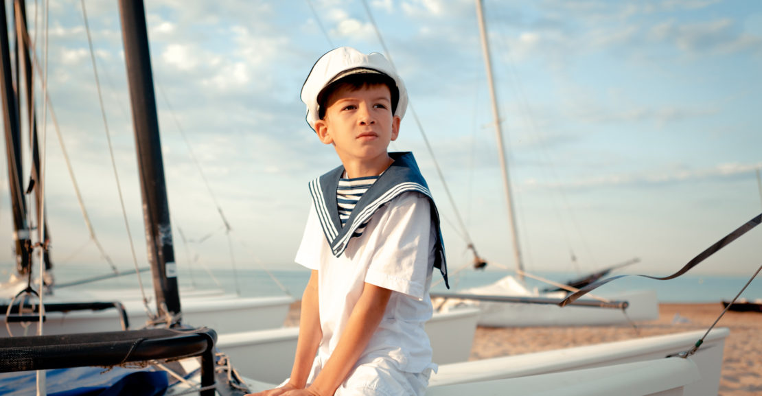 Portrait of young sailor near yacht, outdoor